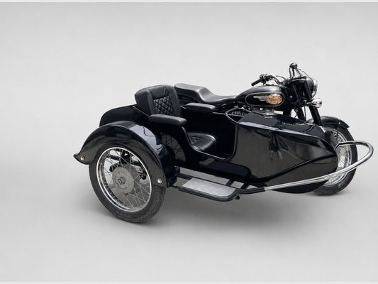 Black motorcycle with Beemer passenger sidecar, all-black quilted seat, unwrapped black armrests, chrome rails, and spoked wheels.