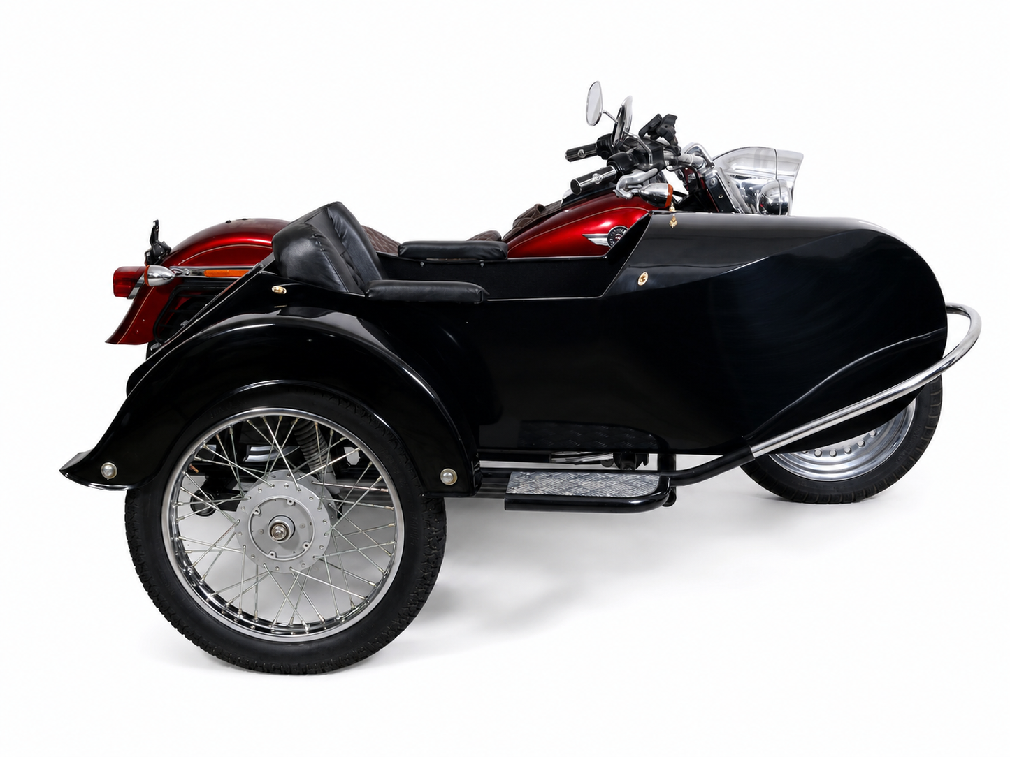 Side view of a glossy black Retro passenger sidecar attached to a red cruiser motorcycle on a white background.