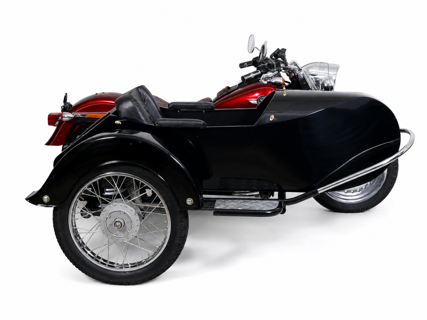 Side view of a glossy black Retro passenger sidecar attached to a red cruiser motorcycle on a white background.