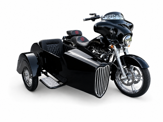 Front-angle view of a black Harley-Davidson touring motorcycle with matching black VOX passenger sidecar and quilted upholstery