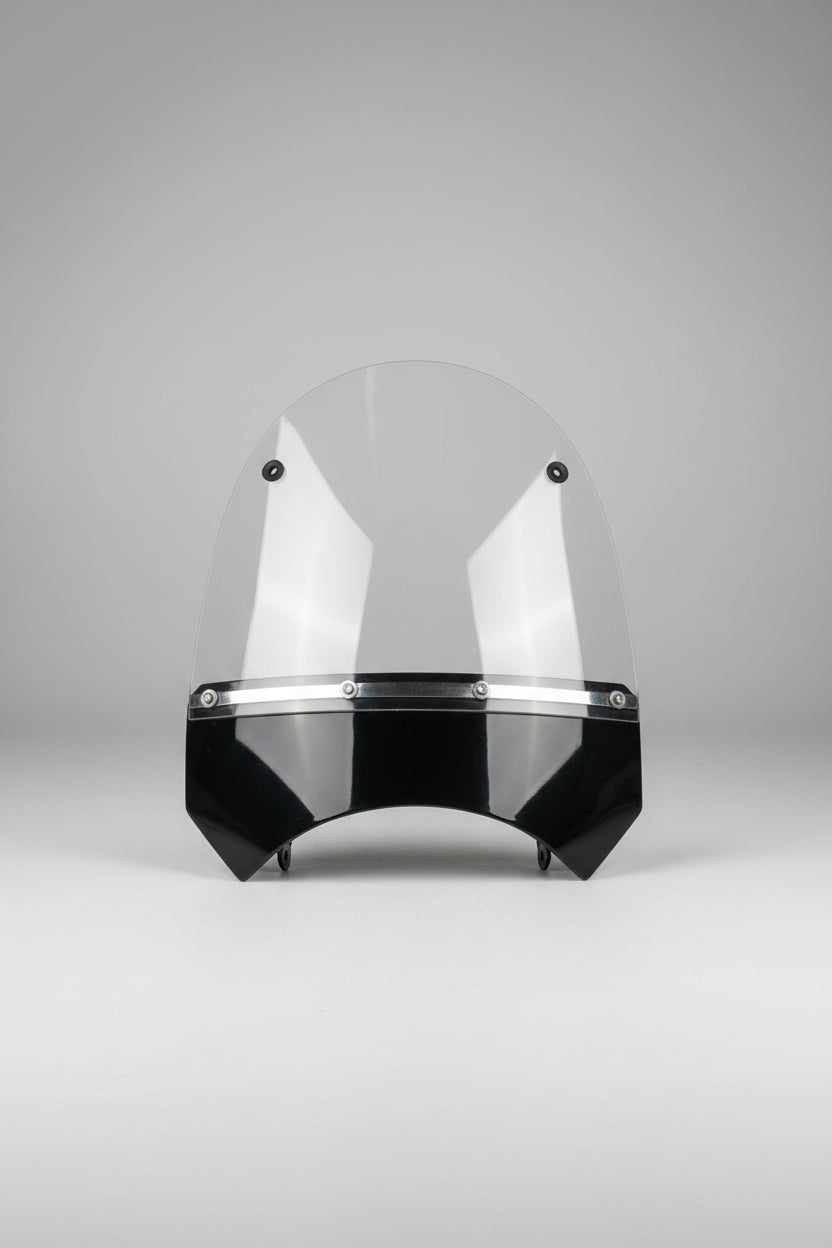 Clear windshield with black bracket on a wooden surface, measured with a tape measure.
