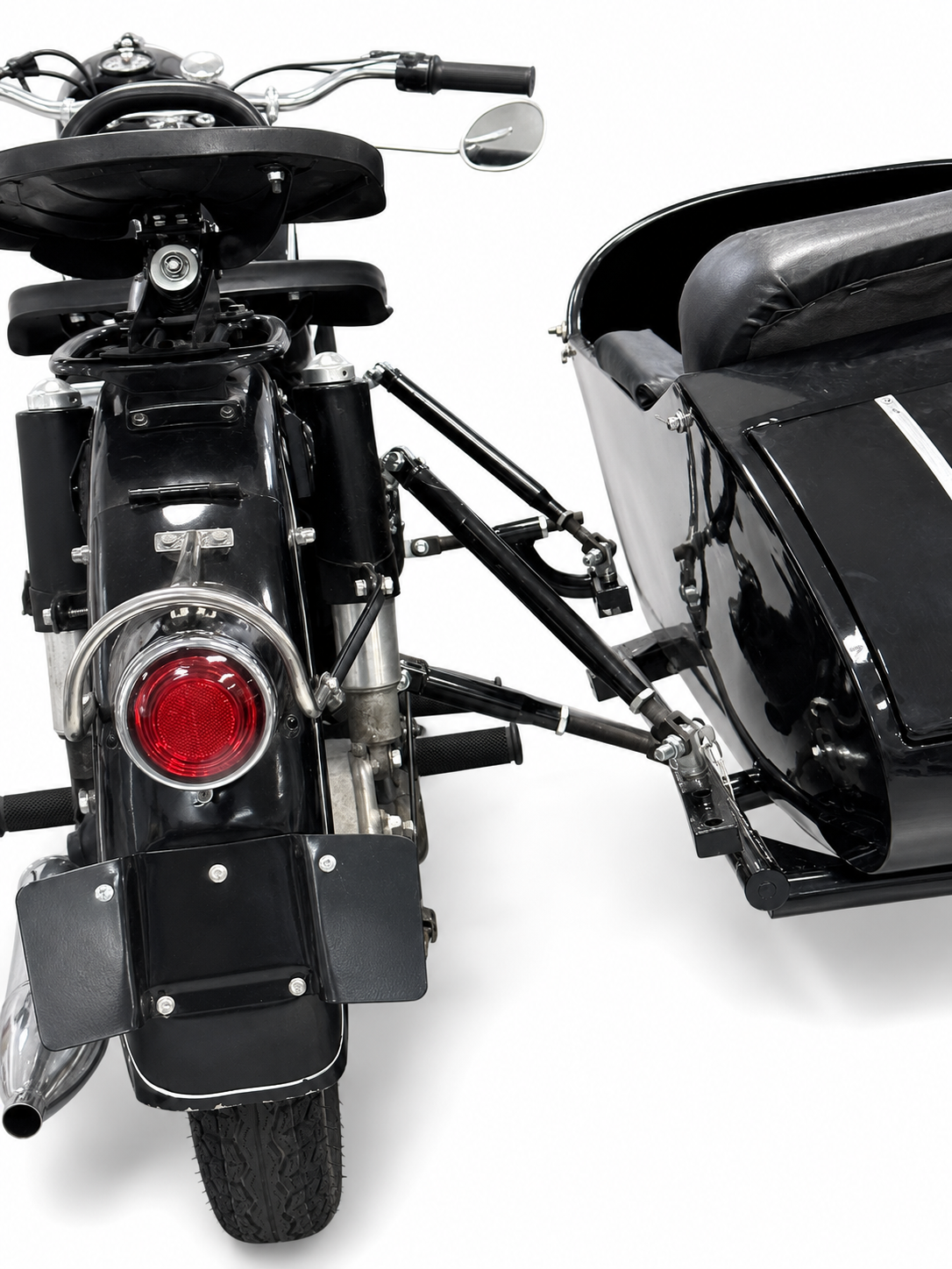 Close-up of adjustable mounting bars connecting a black motorcycle sidecar to a motorcycle