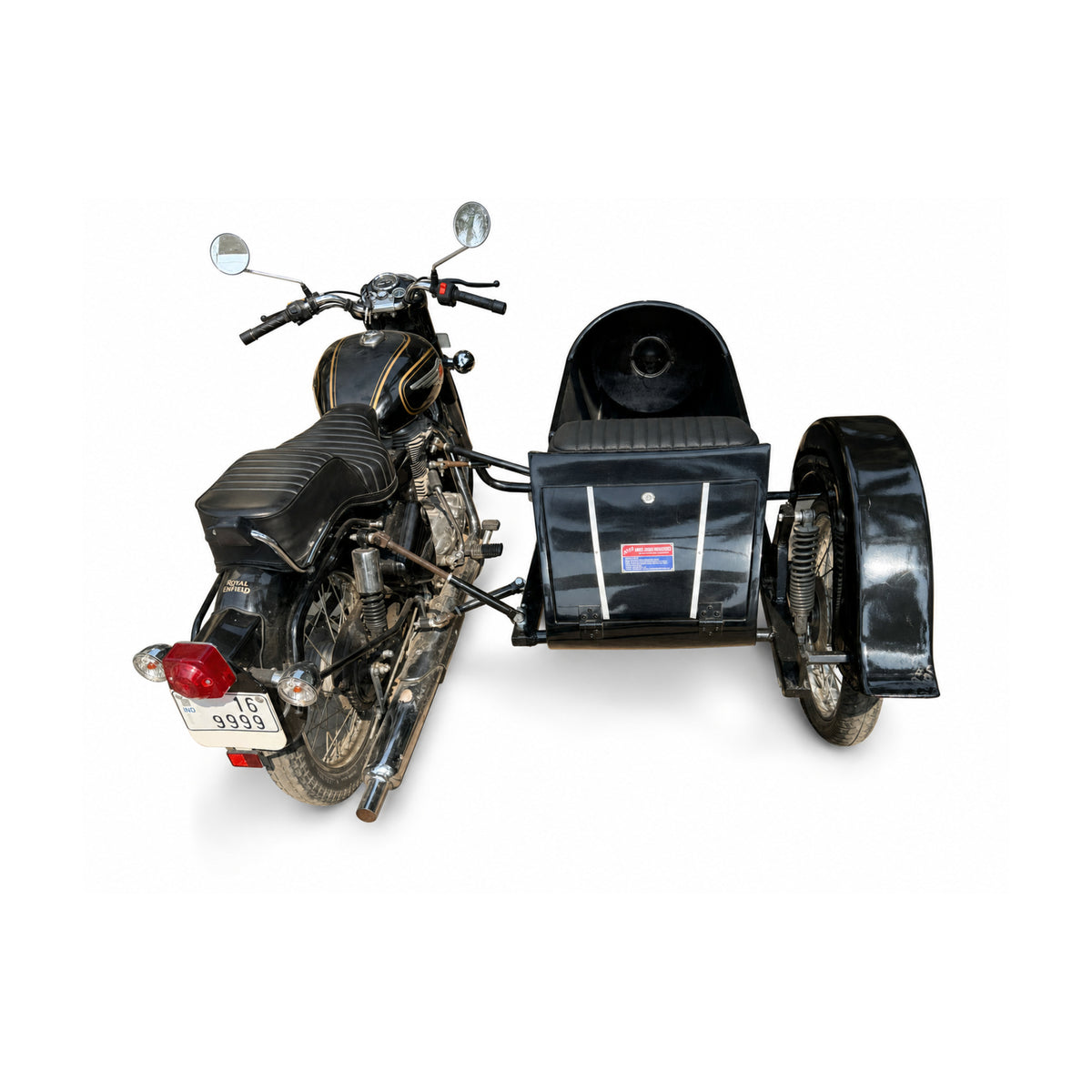 Rear view of a black Royal Enfield motorcycle with attached Razok passenger sidecar on a white background