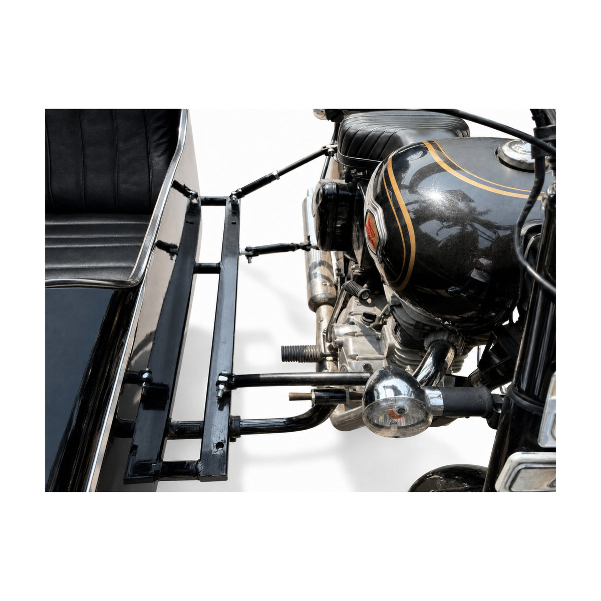 Close-up of Royal Enfield motorcycle sidecar mounting kit, support bars, and connection hardware